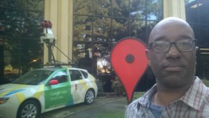 Coates with a Google Streetview car, which travels the world taking 360 degree photos of its surroundings for Google Maps