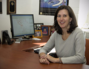 Rachel Davidson, Professor in the University of Delaware's Department of Civil and Environmental Engineering, in front of a computer model.