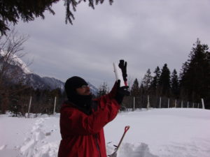 Professor Zender examining snow that he and his colleagues dug from a pit at Col du Porte, in the French Alps.