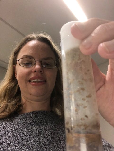 Jill Venton with a vial of fruit flies (Drosophila melanogaster).